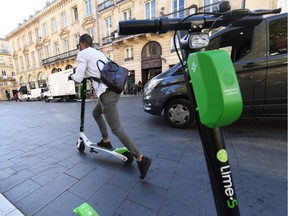 A man rides a Lime electric scooter on September 27, 2018 in the southwestern French city of Bordeaux. The B.C. government is considering amendments to the Motor Vehicle Act that would cove alternative vehicles such as Segways, electric kick scooters and hoverboards.
