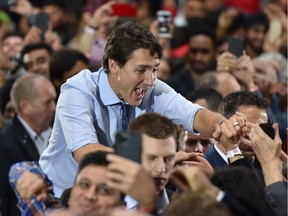 Leader of the Liberal Party of Canada, Prime Minister, Justin Trudeau, greets his supporters during a "Team Trudeau 2019" Rally at the Woodwards Atrium in Vancouver B.C. on October 20, 2019.