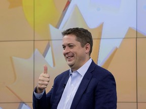 Conservative Leader Andrew Scheer gives a thumbs up to members of the public outside a television studio in Toronto, Thursday October 17, 2019.