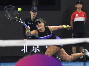 Bianca Andreescu of Canada hits a return during her women's singles third round match against Jennifer Brady of the US at the China Open tennis tournament in Beijing on October 3, 2019.