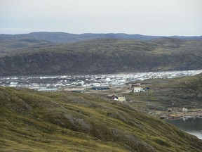 New research has found that Arctic permafrost has warmed to the point where it now releases more carbon in winter than tundra plants can absorb during the summer. The community of Apex, Nvt., is seen from Iqaluit on Friday, Aug. 2, 2019.