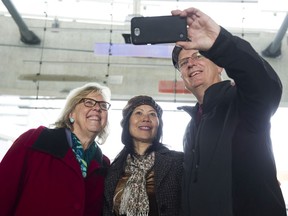 Leader of the Green Party Elizabeth May poses for a photo with voters during a campaign stop at the Brentwood Skytrain station, Burnaby, October 19 2019.