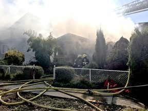 Vancouver firefighters are battling a two-alarm house fire on Sophia Street and 55th Avenue.