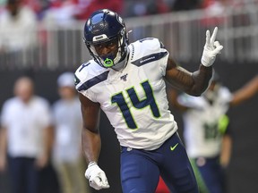 Seattle Seahawks wide receiver D.K. Metcalf reacts after catching a touchdown pass against the Atlanta Falcons during the first half of their Oct. 27, 2019 NFL game at Mercedes-Benz Stadium in Atlanta, Ga.