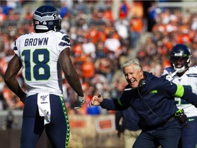 Oct 13, 2019; Cleveland, OH, USA; Seattle Seahawks head coach Pete Carroll congratulates Seattle Seahawks wide receiver Jaron Brown (18) on his third quarter touchdown against the Cleveland Browns at FirstEnergy Stadium. The Seahawks won 32-28. Mandatory Credit: Scott R. Galvin-USA TODAY Sports