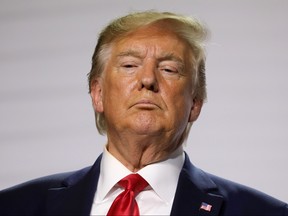 US President Donald Trump looks on during a joint-press conference with French President Emmanuel Macron in Biarritz, south-west France on August 26, 2019, on the third day of the annual G7 Summit attended by the leaders of the world's seven richest democracies, Britain, Canada, France, Germany, Italy, Japan and the United States.