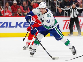 Vancouver Canucks center Bo Horvat takes a shot in the first period against the Detroit Red Wings at Little Caesars Arena.