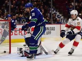 Vancouver Canucks forward Brandon Sutter (20) scores against Florida Panthers goaltender Sam Montembeault (33) during the first period at Rogers Arena.