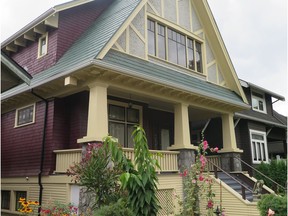 This Vancouver home was painted in colours set out in the Vancouver Heritage Foundation's True Colours program. Those colours of paint, all from Benjamin Moore, include Hastings Red (the base), Edwardian Buff (the trim and half-timbering), Gloss Black (the window sashes) Haddington Grey (the stucco at the roof) and Edwardian Porch Grey (the porch and stair treads). [PNG Merlin Archive]