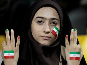An Iran fan gestures before their 2011 Asian Cup Group D soccer match against United Arab Emirates at Qatar Sports Club stadium in Doha January 19, 2011.
