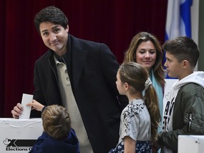 Canadian Prime Minister Justin Trudeau is surrounded by his family as he casts his vote on election day at a polling station on Oct. 21, 2019 in Montreal, Canada. Trudeau's Liberals and Andrew Scheer's Conservatives are in a close race in the federal election, possibly leading to a minority government if neither candidate gets the 170 seats needed to form a majority.