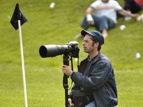 Vancouver Sun photographer Ward Perrin covering the BC Secondary School Rugby Championships at UBC's Thunderbird Stadium in 2003.