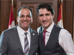 David Sidoo posed with Justin Trudeau in 2016 during the UBC Thunderbirds' meet-and-greet with the prime minister following the football team's 2015 Vanier Cup championship win.