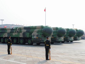 Military vehicles carrying DF-41 intercontinental ballistic missiles drive past Tiananmen Square during the military parade marking the 70th founding anniversary of People's Republic of China, on its National Day in Beijing, China October 1, 2019.