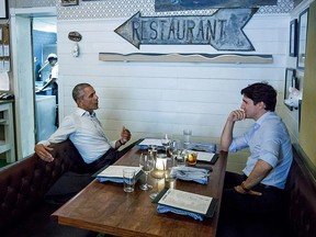 Prime Minister Justin Trudeau (R) meets with former US president Barack Obama at Liverpool House in Montreal for dinner on June 6, 2017.