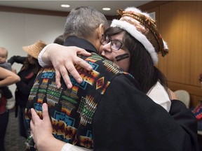 Chief Marilyn Slett receives a hug following a news conference in Vancouver, Wednesday, Oct. 10, 2018. The news conference was to announce the suing of Kirby Corporation by the Heiltsuk government regarding the sinking of an American-owened tug named "Nathan E. Stewart" after it ran aground Oct. 13 2016.