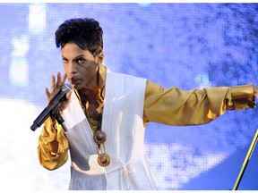 US singer and musician Prince (born Prince Rogers Nelson) performs on stage at the Stade de France in Saint-Denis, outside Paris, on June 30, 2011.