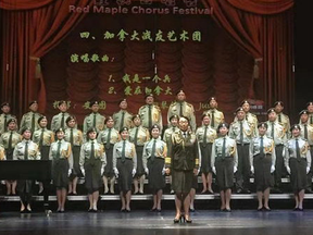 Singers dressed in the uniform of China's People Liberation Army perform at a concert in Richmond Hill, Ont.