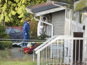 Police at a residence in the 700-block Seaton Avenue in Coquitlam, Wednesday investigate a possible murder.