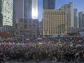 Two Vancouver climate action groups are staging Black Friday interventions for those seeking to consume something other than shopping debt. A crowd of approximately 15,000 people are pictured outside the Vancouver Art Gallery in a climate protest staged earlier this fall.