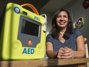 Surrey mom Esmeralda Gomez with a defibrillator she carries around everywhere she goes with her son Alex, who suffered a sudden cardiac arrest this past summer.