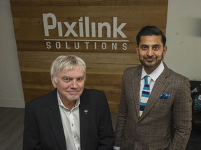 Realtor Les Twarog, left, and Varinder Kainth from Pixilink Solutions at the Pixilink office in Vancouver on Oct. 30. Kainth has developed a new website that shows real-estate sales data and is accessible to the public through a realtor.