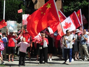 A rally outside the Chinese consulate in Vancouver on Aug. 18, 2019, protests 'police brutality' against pro-Hong Kong supporters in Hong Kong.