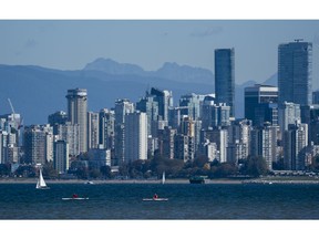 Kayakers takes to the waters of Burrard Inlet on a clear and sunny fall day in Vancouver, B.C.