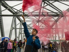 Climate activists with Extinction Rebellion took over the Burred Bridge on Oct. 7 in Vancouver, B.C., as part of a non-violent global rebellion against the inaction by governments to address the climate crisis.