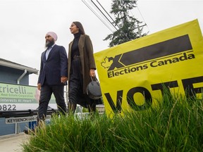 NDP Leader Jagmeet Singh and wife Gurkiran Kaur cast their ballots at an advanced polling station Sunday in their riding of Burnaby South.