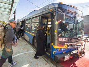 People and buses at Broadway at Commercial Dr. in Vancouver, BC, October 28, 2019.