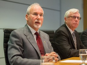 FILE PHOTO: Gary Lenz  (left) and Craig James speak at Fasken Martineau DuMoulin LLP in Vancouver, BC, Nov. 26, 2018.