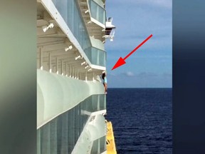 A woman has been banned for life from going on a Royal Caribbean cruise after a fellow passenger photographed her posing for a photo and reported her to ship's crew.