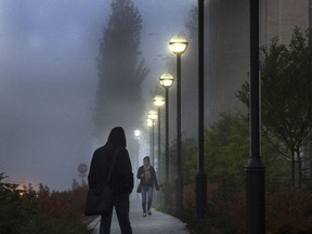 UBC students walk in the fog. Environment and Climate Change Canada is calling for some fog on Halloween night.