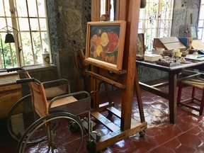 Frida Kahlo’s wheelchair sits in front of an easel at the Casa Azul.