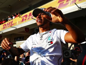 Newly crowned Formula One World Drivers Champion Lewis Hamilton of Great Britain celebrates after the F1 Grand Prix of USA at Circuit of The Americas in Austin, Texas, on Nov. 3, 2019.