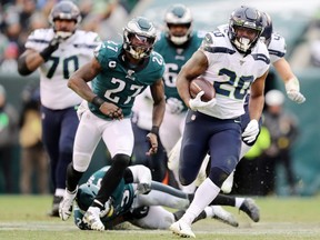 Rashaad Penny #20 of the Seattle Seahawks runs the ball for touchdown in the fourth quarter. The Seattle Seahawks defeated the Philadelphia Eagles 17-9.