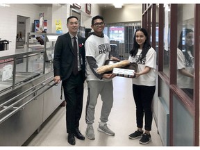 North Delta Secondary principal Aaron Akune needs help to feed hungry students. With him are leadership students Louis Ipis and Tanisha Misra.