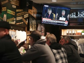 Live testimony of the House impeachment hearings against President Donald Trump is shown on a television at the Billy Goat Tavern on November 13, 2019 in Chicago, Illinois.