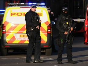 LONDON, ENGLAND - NOVEMBER 29: Metropolitan Police Armed Response officers gather near Borough Market after reports of shots being fired on London Bridge on November 29, 2019 in London, England. Police responded to an incident around 2:00 pm local time, followed by reports of gunfire.