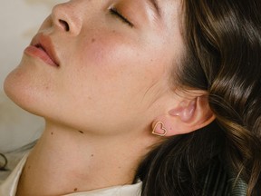 Fall in love with heart-shaped jewelry this holiday season, like these gold-fill earrings from the Vancouver-based brand Kara Yoo.