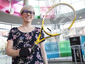Carly Jones, a PhD student at UBC, demonstrates a Velcro glove designed to help Paralympians who would otherwise have to go through roll after roll of tape to secure their grip on sports equipment.