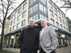 Rental apartment brokers Mark Goodman (left) and David Goodman, principals at Goodman Commercial, stand in front of a recently built mixed-use building combining purpose-built rental apartments and commercial space, on West Broadway in Vancouver on Nov. 18, 2019. [PNG Merlin Archive]
