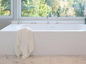 The clean lines of the amanpuri bathtub sets the tone for this bathroom.