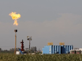 Gas is flared as waste from a shale formation where gas and oil extraction using hydraulic fracturing, or fracking, takes place in California. Deep well and horizontal drilling is used extensively in fracking, which was used to extract natural gas from 98 per cent of wells brought into production in 2017, according to the B.C. Oil and Gas Commission.