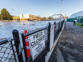 The artificial turf field at Oak Bay High School is closed and covered in plastic.