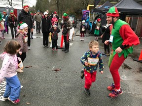 The fifth annual Big Elf Run, scheduled for Saturday, Dec. 14 at Stanley Park, is one of many festive fun runs scheduled for December. Baxter Bayer, right, of the Vancouver-based Running Tours Inc. has made American Express's Top "Seasonal events with a Twist" list with his popular Elf Run.