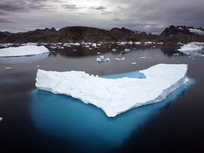 Icebergs float in a bay off Ammassalik Island, Greenland on July 19, 2007. A new report from the international medical journal The Lancet says a child born today will never know a life where their health isn't placed at risk by a warming planet.