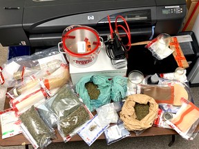 Picture of Item seized by CFNIS on July 12, 2019: 1,450 grams of vegetative cannabis; three cans of compressed butane; a propane canister; vacuum chamber attached to a vacuum pump; one baking dish; two grams of Psilocybin (Magic Mushrooms); and cannabis solid concentrate.