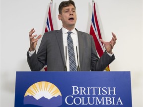 David Eby gestures during a press conference in 2019.